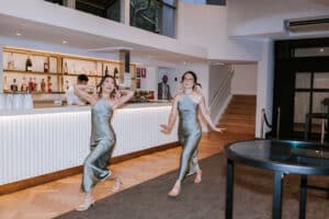 Bridesmaids performing a fun choreographed dance during their wedding reception entrance at San Martin Akuna Bay, with Unity Entertainment MC.