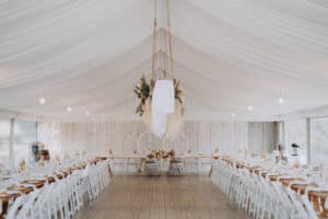 The Growwild marquee set up for Aleisha and Mitchell's wedding reception, styled with dried florals and festoon lighting.